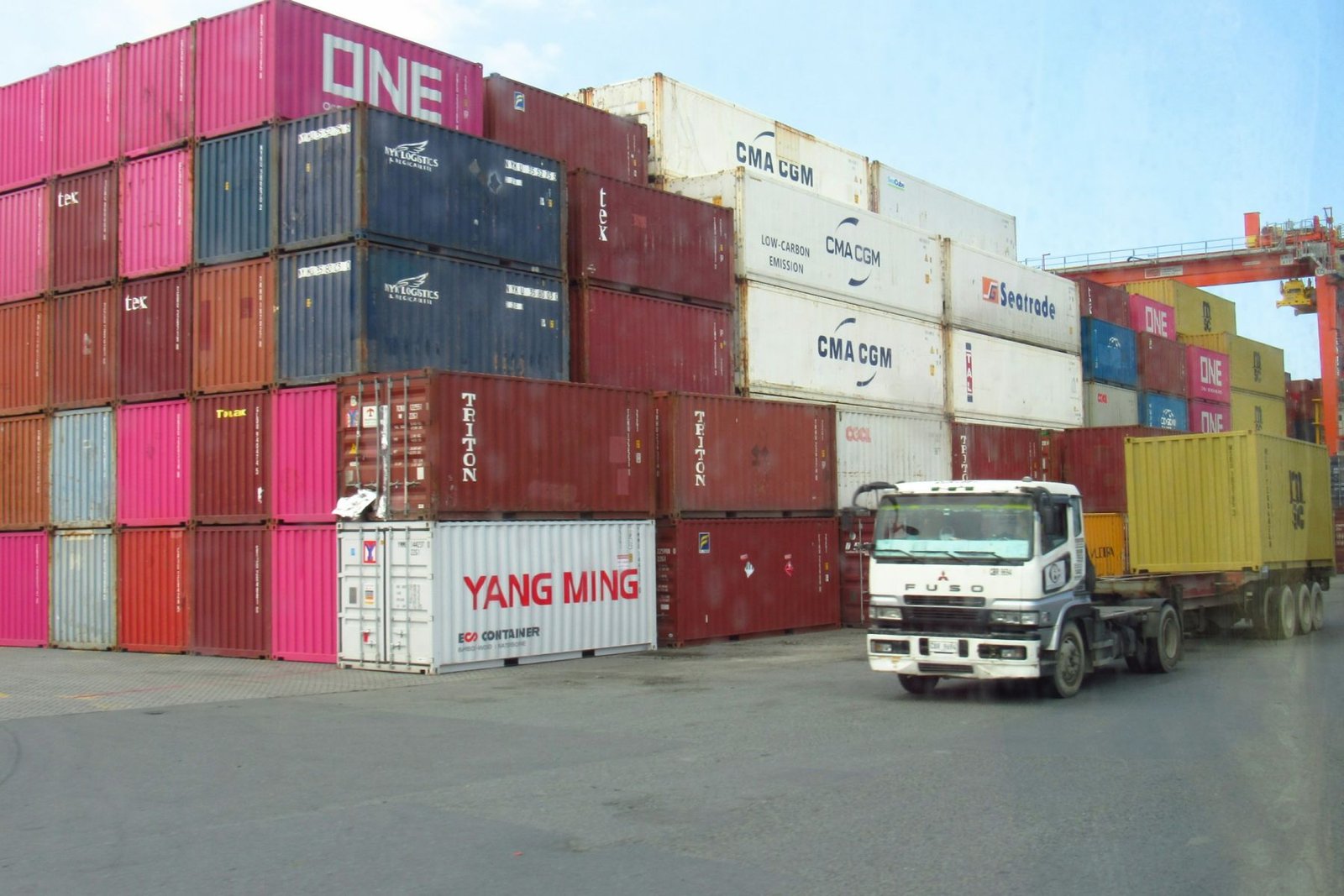 Shipping containers and a truck at a container terminal